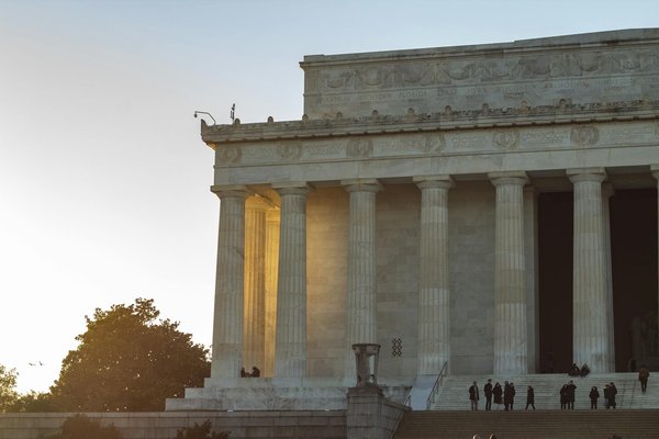 How can you effectively use a rail pass to explore multiple UK cities?